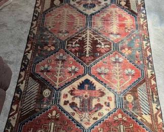 Dimensions: 6’ 0” x 3’ 8” Description: Hand knotted foundation is cotton and pile is 100% wool.  Color: Beige tribal design Style: Nomadic or Anatolian Origin: Bakhtiar, made in Iran. Age of the rug is between 80-100 years old  Price: $300