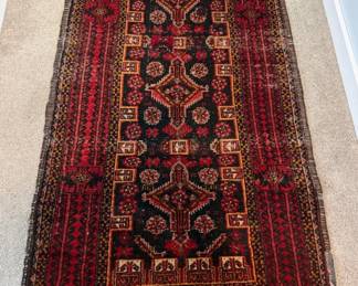 Dimensions: 1”10” x 2’8” Description: Hand knotted Vintage Persian runner  Material: 100% wool Design: Bold geometrical central medallions tribal motif Color: Deep red with navy & gold accents. Region: Baluch or Afghan Price: $300