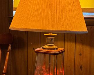 The coolest lamp ever!! The bottom lights up with red flickering bulbs that look like candles.