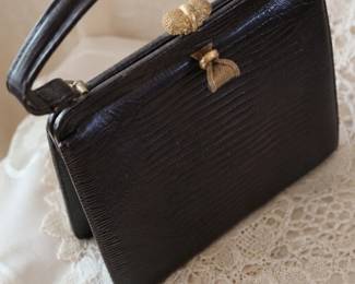 A collection of vintage purses, jewelry, and wardrobe pieces