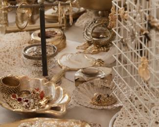 A large collection of vintage costume jewelry, including necklaces, bracelets, earrings, brooches, and other unique pieces.