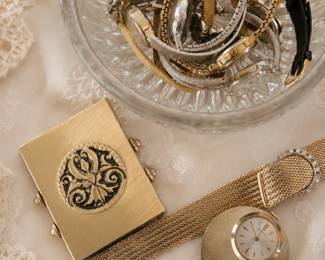A large collection of vintage costume jewelry, including necklaces, bracelets, earrings, watches, brooches, and other unique pieces.