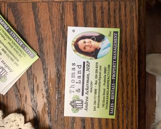 Card with the realtors name selling house, Andrea Ackerman.