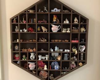 Wall hanging with miniature collections. 