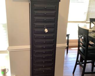 Black cabinet with 13 drawers & door.  Price: 110.00