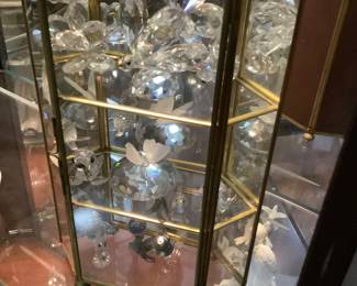 Small glass display with collection of Swarovski crystals. Several more.