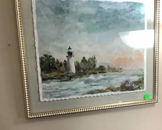 Beautiful picture of the ocean and light house.