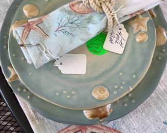 China with shells.  4 place setting.  Has napkins and place mats to match.