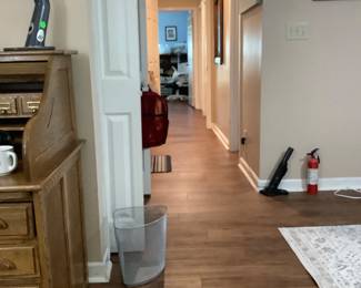 View down the hall of house.  Has wood floors throughout except bathrooms.