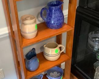 Small pine book shelf with more pottery.