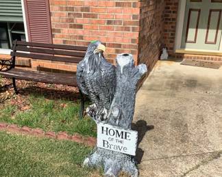 A statue showing his love of his country and a bench in front. Price 60.00: