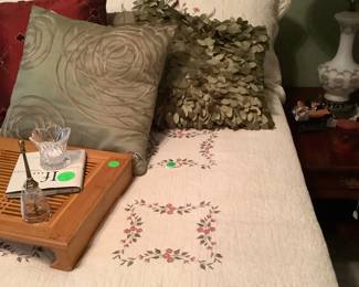 Close up of wood tray on bed.