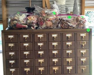Antique Filing wood cabinet, 60 drawers, on rollers.  2,500.00