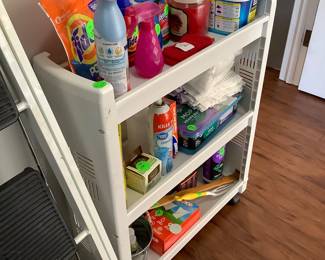 Plastic stand for laundry supplies.