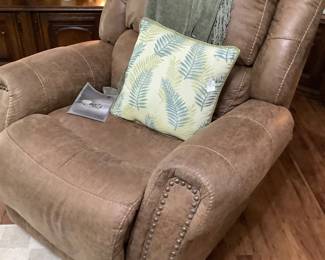 Brown leather recliner. Price: 225.00
