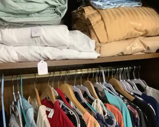 Sheets and pillows in wardrobe.