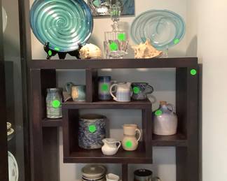 Two beautiful glass bowls on the bookcase.  Black cabinet: 125.00