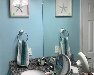Master bath.  Items on the beautiful granite counters.