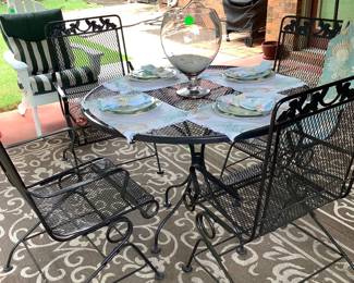 Round metal table with 4 black chairs that bounce.  Price:  160.00