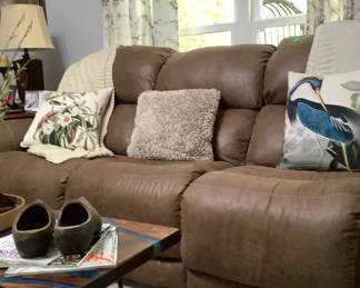 The brown leather reclining couch. Price: 325.00