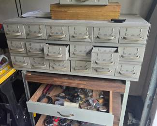 Metal bin with bolts, screws 