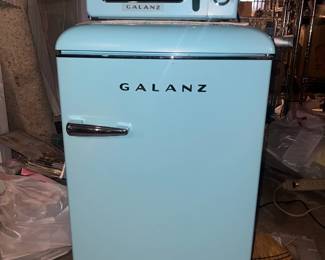 Matching baby blue Galanz mini fridge and microwave set 