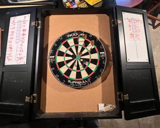 Wooden dartboard cabinet with dry-erase score tracking. 