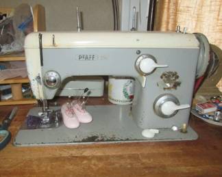 Pfaff 240 tailoring/drapery machine. Works beautifully. In commercial wood table with 1/2 hp motor. Needs a minor part but otherwise in great shape..