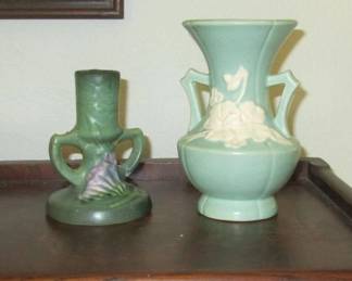 Weller and Roseville pottery. The Roseville candleholder dates to the mid 40s and the Weller vase to the 30s. Both in excellent condition. More vintage pottery besides these!