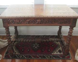 Rare quarter-sawn oak antique table with barley twist legs and leaf mask carving on drawer. Entirely handmade. Late Victorian from the Cabot estate.