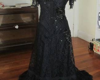 How gorgeous is this? A tailor-made (from an 1895 pattern), two-piece evening gown. Made for a museum and respectfully worn and maintained. Seller offers a Victorian-style corset, handbag, and accessories, too! Victorian gown. Lace over satin underskirt, fully lined, lavishly embellished with black AB appliques and beadwork. Size 6. A new Victorian corset also available, and a vintage black Czech glass bead necklace. Win the Halloween/Gothic costume contest in this beauty, or just display it on a mannequin for decor elegance.