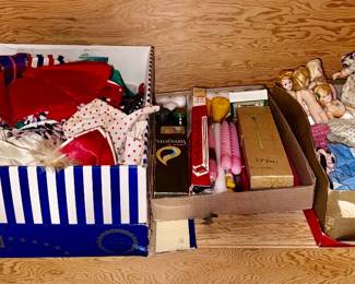 box of large doll clothes and Dolls and clothes
