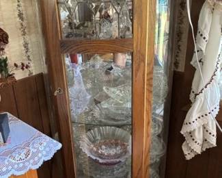 Curved curio cabinet and crystal glass ware