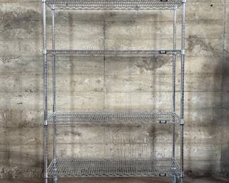 This lot features a quality four-tier rolling steel wire shelving unit by ULINE in excellent condition and measures, 70” H x 48” W x 18” D.