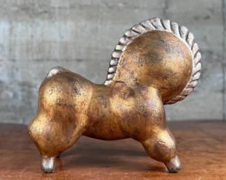 This lot features a unique circus horse sculpture “Libbiloo” by listed designer, Russel Wright circa mid-20th century.