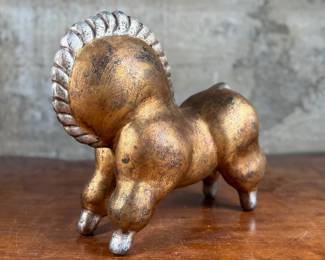 This lot features a unique circus horse sculpture “Libbiloo” by listed designer, Russel Wright circa mid-20th century.