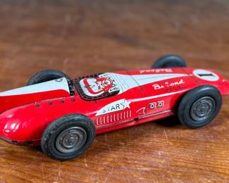 This lot features an antique Belond Special open-wheel tin friction race car, manufactured in Japan by Toymaster.