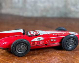 This lot features an antique Belond Special open-wheel tin friction race car, manufactured in Japan by Toymaster.