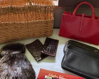 Red leather purse and hand-woven beach bag, raccoon and leather gloves, Ferragamo key chain