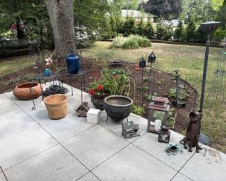 Planters, stands, yard art, copper lanterns and fountain, and tiki torches (3)