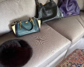 Mink hat and Coach purses