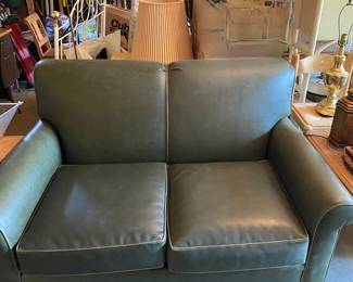 2 matching green loveseats