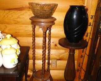 Tall wooden stands with some great vases on top of them