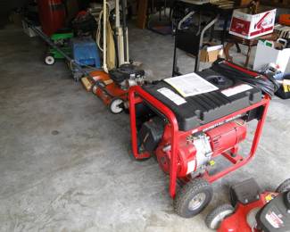 A few lawnmowers and a Generac Generator