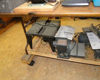 In case you missed the last picture, starting on the left, we have a router table, a top of the table belt sander, and a precision scroll saw