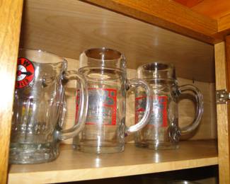 Budweiser mugs, and an A&W mug