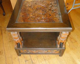 Carved table with glass top