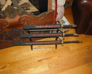 3 piece Japanese Samurai sword set.  The bottom one is Katana.  The middle one is Wakizashi.  The smallest one is Tanto