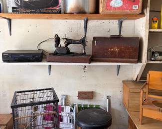 Vintage sewing machine, bird cage, large pot