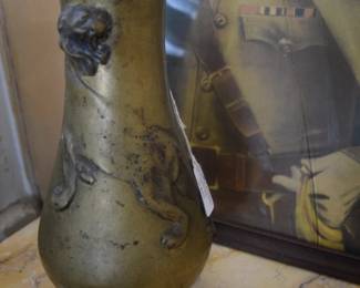 Antique Brass Vase With a Lion In Relief On It